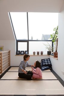 Konishi and Mika play a string game in the tatami room under a skylight meant for moon gazing.<br><br>Don't miss a word of Dwell! Download our FREE app from iTunes, friend us on Facebook, or follow us on Twitter!