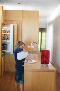 Almost Perfect - Photo 1 of 8 - The kitchen is built from hoop pine plywood, including the countertops and front of the refrigerator. The leather drawer-pulls will patina over time.