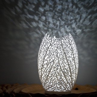 Coral Motifs - Photo 3 of 3 - The Hyphae Lamp is a new series of algorithmically generated lighting designs by Nervous System. The lamps are 3D-printed to order, made of in nylon and illuminated with eco-friendly LED lights.