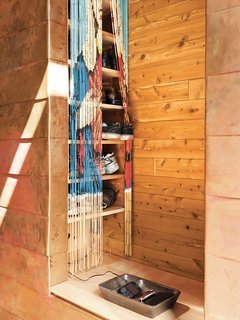 Seeing Double<br><br>To cover up his shoe-storage shelves, Sherman bought bamboo bead curtains from the Callaloo Company emblazoned with an image of the Madonna. He separated out every other strand to create two curtains from one, resulting <br><br>in twinned pixelated images. The resulting pattern is "like a Chuck Close that everyone can afford," says Sherman.