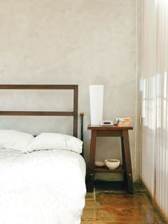 Sheer Genius<br><br>The master bedroom wall that faces the light well is made from a double layer of corrugated-plastic panels, with a sheet of vinyl from Canal Plastics Center sandwiched between them for translucency. The wall lets sunlight and moonlight into the room while still maintaining privacy.