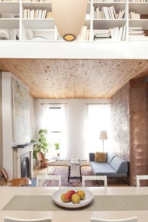 Now You Cedar<br><br>To make sure the light well over the dining area read as "a hole, rather than just a bending of the Sheetrock plane," Sherman clad the first-floor ceiling in inexpensive tongue-and-groove cedar closet liner from Home Depot. Bonus: "I like the smell of cedar," says Sherman, and now the house carries a faintly woodsy scent.