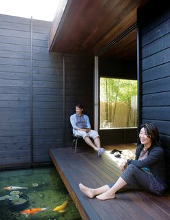 An Atypical Modern Home in Southern California - Photo 3 of 15 - With doors open, Shino and Ken pull an Eames LCW chair for Herman Miller outside to enjoy the space.