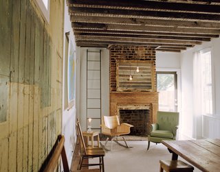 The ladder, created by Peyton Avrett, is an unorthodox way to the upstairs, and it also serves as a fire escape since the house only has one stairwell.