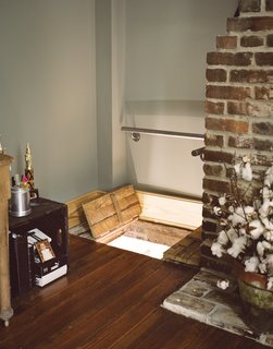 An aperture in the floor of the master bedroom leads down to a sitting room via a ladder.