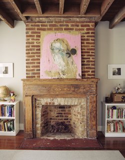 The couple plans on relining the flues this winter, but in the meantime the mantels serve as much needed horizontal space.