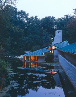 Jump ahead to 1939 and Dow was into the house that he would live in. You can see the lights of the submarine room which sits right at water level. Seats just below the window let the sitter trail a finger in the pond just outside.