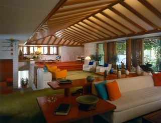 The Dows loved to host and their massive living and dining room had ample space for parties. Decor came largely from Dow's designs and the treasures they collected on their travels.