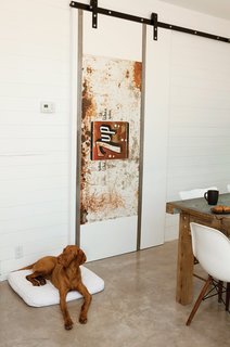 A resalvaged 7-Up sign that is now on the door of the TV room of the Suttles and Shah house.