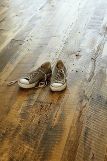 The wood floor of the Suttles and Shah residence reclaimed from a barn in Missouri.