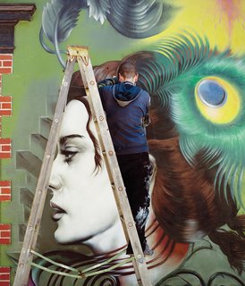 The new outdoor wall mural in progress by artist Seth Depiesse on Main Street.