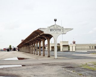 Downtown Wichita offers a compelling mix of old—such as a weathered concrete sign by the train tracks at the disused Union Station on Douglas Avenue.