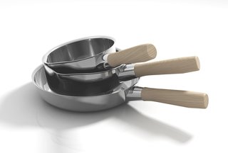 The Shiba collection frying pans are made of stainless steel with either wood (shown) or bakelite handles.