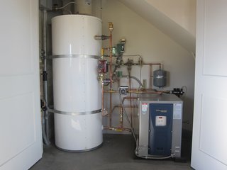 A Zero-Energy Community: Part 2 - Photo 4 of 9 - A mechanical marvel, our ground source heat pump. We’ll go more granular on this in a future blog. I show it here because it’s our single most important conservation item.