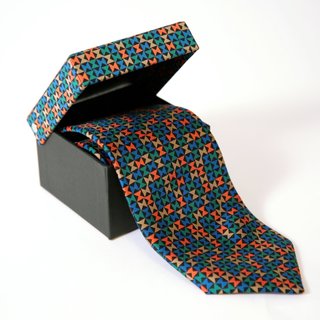 Inspired by the Miller House - Photo 4 of 5 - The Pinwheel pattern reappears in a different form on this graphic silk tie.