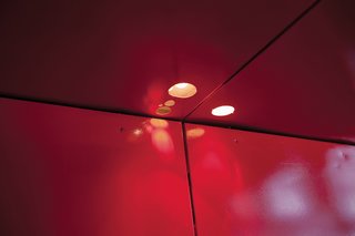 The original doorknob cutouts now act as openings for overhead lights