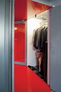 Fontanez solved LOT-EK’s conundrum of how to situate the bed against the center wall while still maintaining closet access by suggesting an automated dry-cleaning rack in the narrow closet. He and Russell access the closet from opposite ends. "We just have to make sure we don’t spin it at the same time," Fontanez says.<br><br>Don't miss a word of Dwell! Download our FREE app from iTunes, friend us on Facebook, or follow us on Twitter!