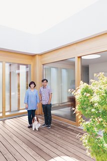 Paul and Shoko stand on the ipe deck with their dog, Mei. "At first, we really wanted an Eichler, but it just did not work out. But after seeing a few we knew we had to have a courtyard home," says Paul.