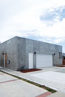 The unadorned street-facing facade of the house belies the light, open, tranquil space inside.