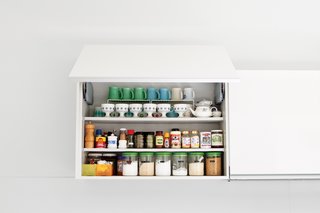 Hide Your Food Away<br><br>The aesthetic throughout the house is supremely uncluttered, and that goes double for the kitchen, which dominates the central public space. "My wife is the master organizer," says Paul. "In Japan space is so tight, I think it is in their DNA." The kitchen and wall-storage system by the German company Leicht continues the muted design palette and conceals it all from the microwave to the dishes.<br><br>leicht.de