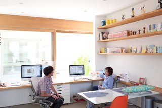 The pair of desks that Paul and Shoko work at in the office space look directly onto the courtyard. The concept for the design was to be able to see the sky from your seat at the desk.