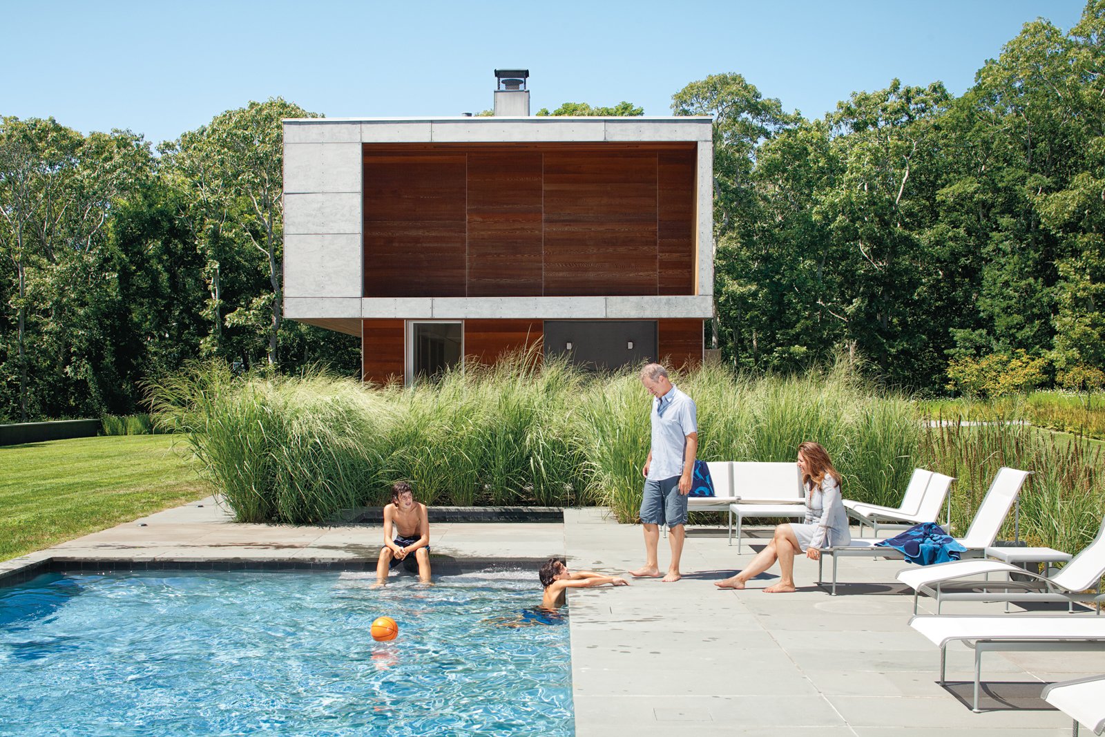 The Pryors relax at their Montauk retreat among modular furniture from Richard Schultz's Swell Seating Collection and chaise longues from his 1966 collection from Knoll.