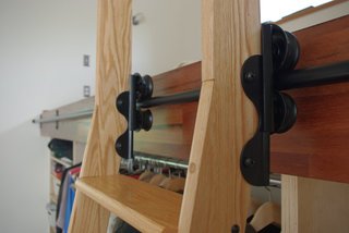 Loads of readers wrote in to ask how Matt and Katherine get into their lofted bed. The answer (purchased after our photo shoot) is a library ladder.