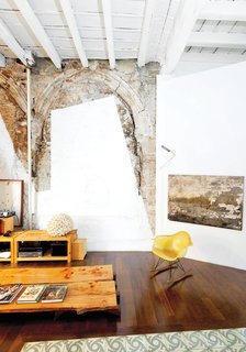 Immediately halting the crew, Tagliabue and Miralles decided instead to celebrate the juxtaposition by leaving it all in situ. The painting at right was also found inside the meandering structure, which had been unoccupied for decades.
