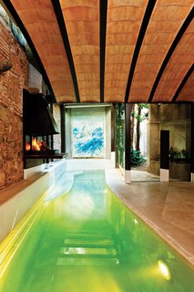 One of the most significant architectural developments within Tagliabue’s property is the pool house, which features a shallow lap pool and a wood-burning fireplace.
