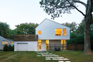 Previously, the house had just a small screened-in porch as its only outside space, "unless you wanted to put plastic chairs on the front lawn, which some people did," Braver says, laughing. A generous roof deck atop the garage was a winning way to allow a survey of the neighborhood during Massachusetts’ Indian summers.
