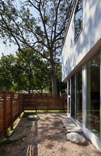 A pair of large outdoor rooms projects off the glassed-in living room at the front of the house (here) and the kitchen in the back. By better connecting the home to the outdoors, SsD further increased its livable area. "For the part of the year that they’re usable," Braver says, "they’re wonderful spaces in which to read and to enjoy."