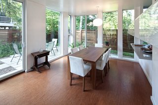 The dining room, just off the kitchen, is actually down a half level from the living room and entry. You can see the other outdoor room outside the sliding glass door.