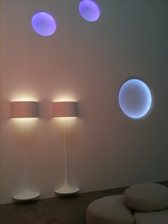 Flos Shop in San Francisco DZINE Showroom - Photo 4 of 9 - Two of Sebastian Wrong's Spun Lights hover over the floor, beneath three glowing Circle Lights.