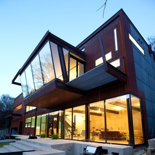 A steel grate catwalk off the master bedroom floats above the concrete patio, and the whole structure glows like a lantern at night. Photo by Brian Mihealsick.<br><br>Don't miss a word of Dwell! Download our FREE app from iTunes, friend us on Facebook, or follow us on Twitter!