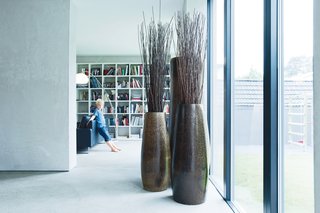 Three’s CompanyInspired by the minimal color scheme of a hotel they stayed at in Bali, Winterhalder and Ehlers decided to limit their palette to three colors: anthracite black, concrete gray, and a light larch wood. The first move was to paint the backyard wall gray. Next up for a coat of dark paint was the villa’s old-fashioned wooden staircase, which the couple didn’t like but didn’t have the budget to replace. The consistency works to unite the different styles found in the house. "Somehow," says Winterhalder, "it all fits."