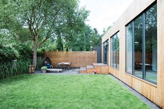 Glass HousesThough the original plans called for a frameless wall of glass in the back, it turned out that it would eat up most of the budget. Instead, they installed three wood-framed windows made by Fecon. fecon.de<br><br>Cut and PlantFor the landscaping, the couple literally took a page out of somebody else’s book. Winterhalder says their garden was lifted from page 38 of Peter Janke’s Kleine Gärten (Small Gardens), published by Becker Joest Volk Verlag. bjvv.de
