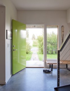 Keep an eye out for pops of color around Whitlock's house. The window frames, door, and kitchen all make use of lively hues to add a burst of character.