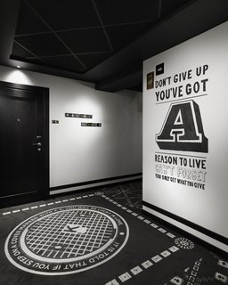The Scandic Grand Central, Stockholm - Photo 4 of 12 - The interiors are by local firm Koncept. While the lobby is a mix of rich colors and textures, the corridors are monochromatic with quotes emblazoned on the walls. The patterns on the carpet are inspired by Stockholm's manhole covers.