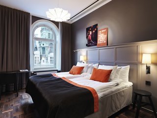 The Scandic Grand Central, Stockholm - Photo 6 of 12 - Here's another suite in the hotel, which is similar to the one in which I'm staying. My junior suite is a corner room located on the fifth floor overlooking the neoclassical rooftops of the Norrmalm district, and the bustling intersection of Kungsgatan and Vasagatan. It's kitted out with high ceilings, loads of natural daylight, desk, flat-screen T.V., sofa, and...