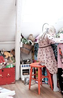 Maja's room is filled with toys and includes a little desk area for drawing and writing.