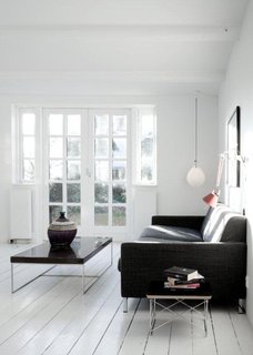 French doors in the living room let light into the kitchen and open onto a lovely garden.