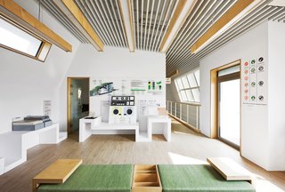 Modern Green Concept House in South Korea - Photo 3 of 10 - Smart GalleryThis second-floor gallery displays the green materials and technologies Unsangdong and Kolon built into the house. The two firms teamed up on the furniture design as well.