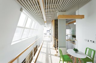 Modern Green Concept House in South Korea - Photo 5 of 10 - Windows UpdateBy angling the second-story window away from the hall, Unsangdong created an expansive space without adding to the house’s footprint. A building-integrated photovoltaic window by Kolon does double duty bringing both light and energy into the house.
