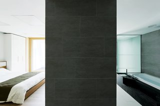 Modern Green Concept House in South Korea - Photo 7 of 10 - Serenity nowDesigned to suit all the needs of a Korean family of four, the interior takes what Unsangdong calls "emotional design" as seriously as energy efficiency. This tranquil ground-floor bedroom and bath were created with the help of Japanese interior designer Kondo Noriko.