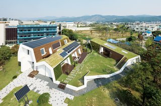 Modern Green Concept House in South Korea - Photo 9 of 10 - Big Man on CampusBuilt on Kolon Engineering and Construction's grounds, the E+ Home is the neighborhood's green building star. From this angle you can see the permeable pavers and sustainable landscaping, like water catchment pools and living walls, that make this place a paragon of green housing.