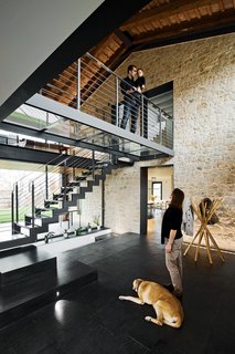 Locally sourced Italian slate covers the ground floor rooms; the coat rack near the entrance is from Zanotta.