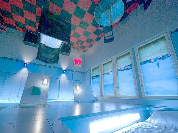 Propeller Island Hotel, Berlin - Photo 5 of 9 - Although the furniture’s orientation may set your sense of direction spinning, the beds and chairs are stowed underneath the floorboards.