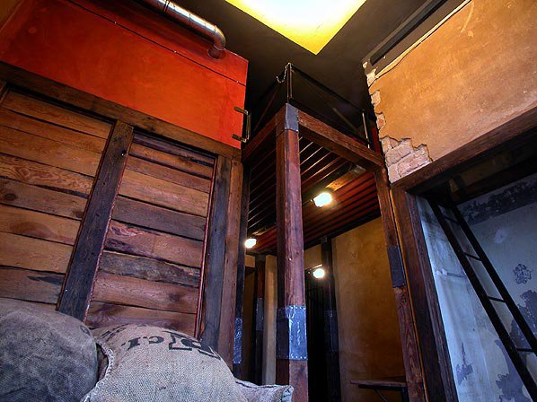 Propeller Island Hotel, Berlin - Photo 7 of 9 - Built out of the original rafters of the hotel, Larchenson modeled this room after a barn. Lounge on potato sacks filled with foam rubber and climb up the hidden ladder to your bed.