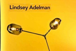 Dwell favorite Lindsey Adelman contributed a stunning floor lamp in vintage brass with a grey globe and grey pod.