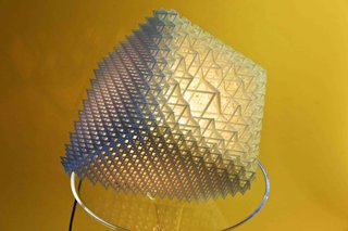 Dror applied his QuaDror geometry to one flat, 3D, sls print of interlocking squares. When illuminated, the beauty of the complexity of the shape is highlighted through the various effects the light has on the hundreds of squares that make up the collapsible form. The light is diffused in a way that gives the structure a bright, warm glow in the center, which gradually fades into cooler, darker shades on the edges and corners of the cube.